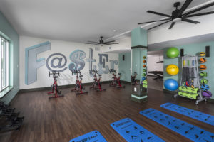 Fitness center in Gather Uptown Apartments